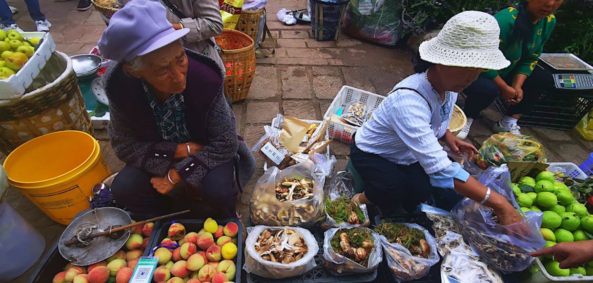villagers in the bazzar of Shaxi Ancient Town in Dali
