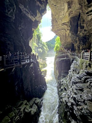 photo of river running into tenglongdong cave 
